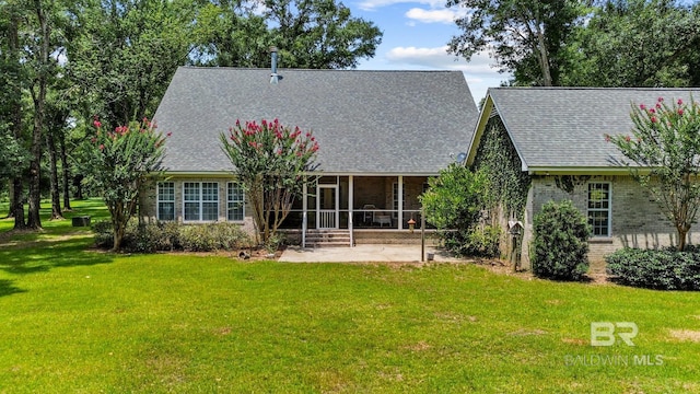 back of house featuring a yard