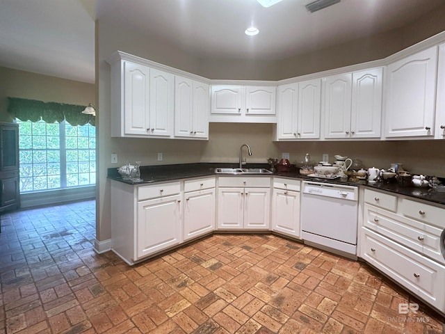 kitchen featuring white cabinetry, sink, and white dishwasher