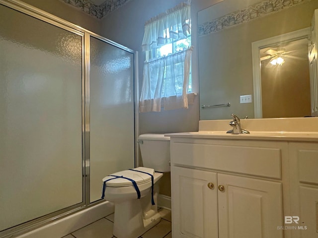 bathroom with tile floors, an enclosed shower, large vanity, and toilet