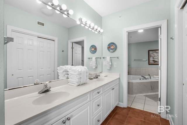 26200 Perdido Beach Blvd Unit 508, Orange Beach, AL 36561 - full bathroom featuring double vanity, a sink, tile patterned flooring, and visible vents