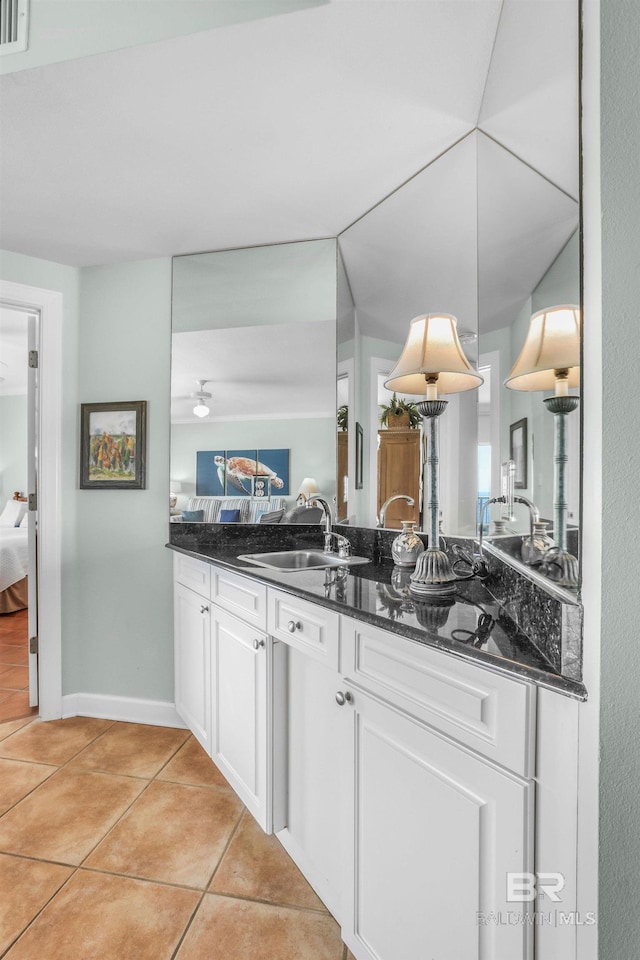 26200 Perdido Beach Blvd Unit 508, Orange Beach, AL 36561 - kitchen featuring light tile patterned floors, visible vents, white cabinets, a sink, and baseboards