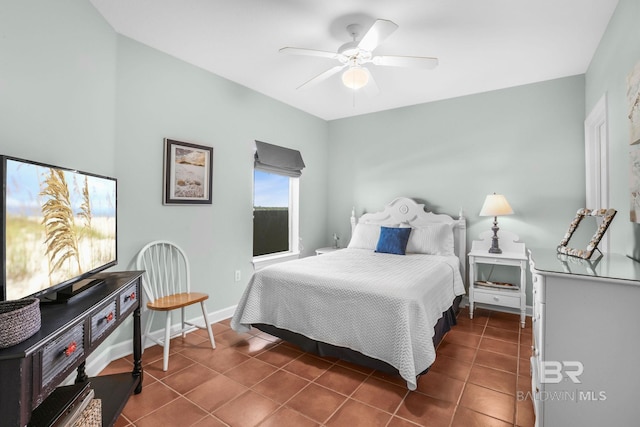 tiled bedroom featuring ceiling fan