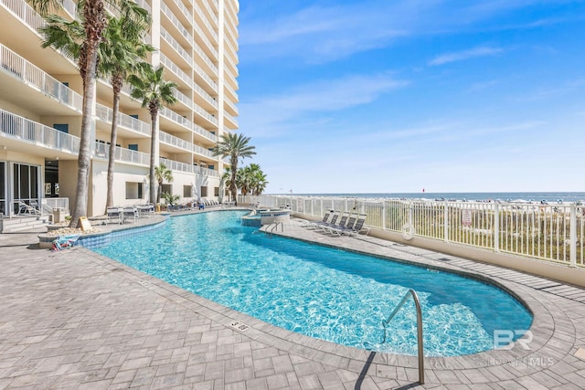 26200 Perdido Beach Blvd Unit 508, Orange Beach, AL 36561 - pool featuring a patio area and fence