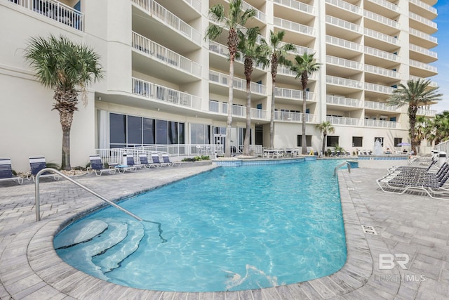 view of swimming pool with central AC unit