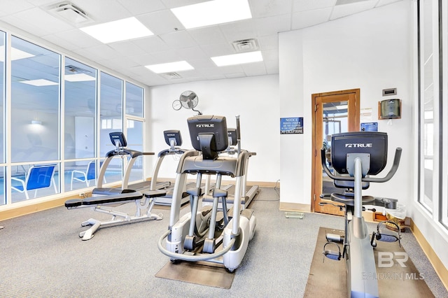 26200 Perdido Beach Blvd Unit 508, Orange Beach, AL 36561 - gym featuring baseboards, a drop ceiling, visible vents, and a wealth of natural light