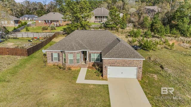 view of front of home with fence, an attached garage, driveway, and brick siding