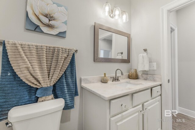 bathroom with vanity and toilet
