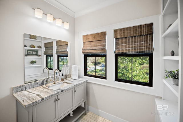 bathroom with baseboards and vanity