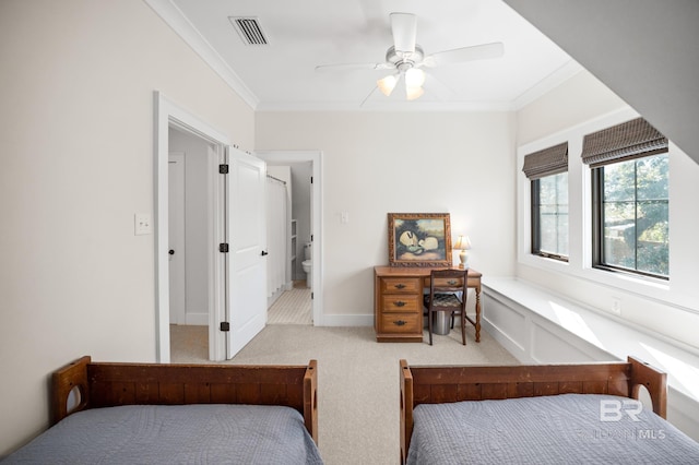 bedroom with ceiling fan, ornamental molding, visible vents, and light colored carpet