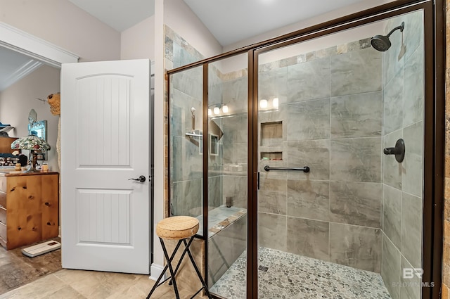 bathroom featuring hardwood / wood-style flooring, ornamental molding, and a shower with door