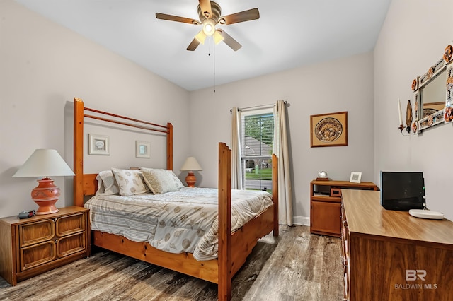 bedroom featuring ceiling fan and dark hardwood / wood-style flooring