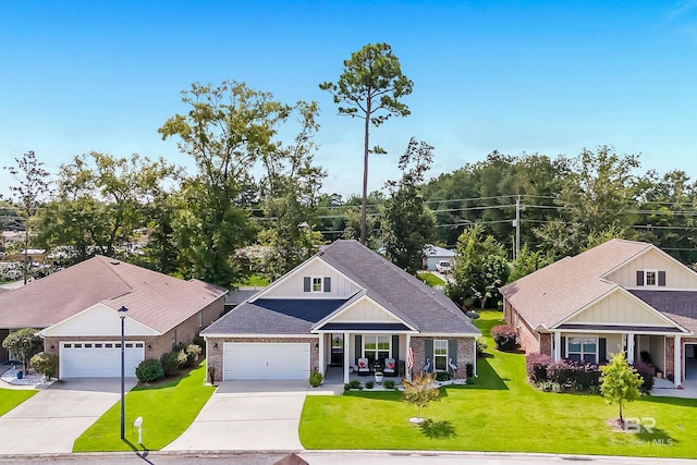 craftsman-style home with a front lawn and a garage