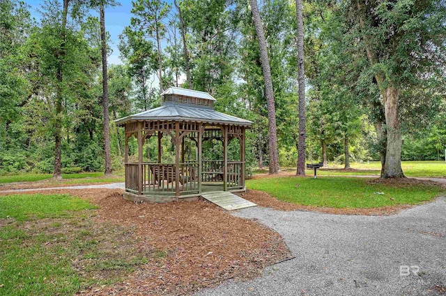 view of home's community with a gazebo and a yard