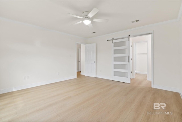4310 Lauder Ln, Orange Beach, AL 36561 - unfurnished bedroom with light wood-style flooring, crown molding, baseboards, and visible vents