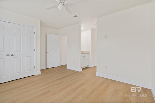 4310 Lauder Ln, Orange Beach, AL 36561 - unfurnished bedroom featuring a closet, visible vents, light wood-style flooring, baseboards, and a ceiling fan