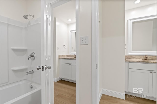 4310 Lauder Ln, Orange Beach, AL 36561 - bathroom with vanity, recessed lighting, baseboards, bathing tub / shower combination, and wood finished floors