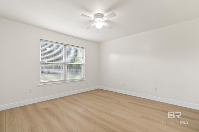 4310 Lauder Ln, Orange Beach, AL 36561 - empty room with baseboards, light wood-style flooring, and a ceiling fan
