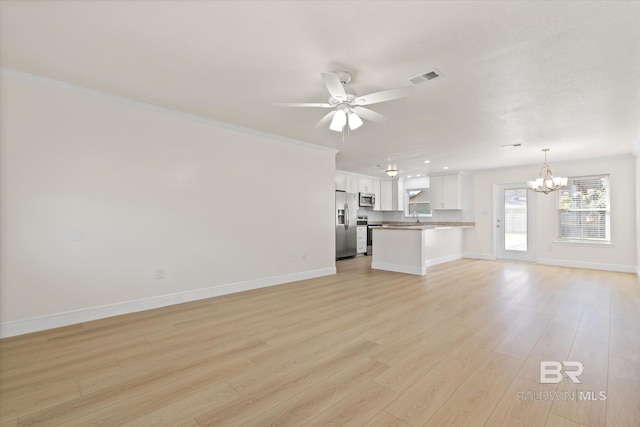 4310 Lauder Ln, Orange Beach, AL 36561 - unfurnished living room with light wood-style flooring, ceiling fan with notable chandelier, baseboards, and visible vents