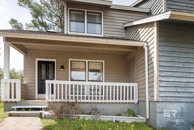 doorway to property featuring covered porch