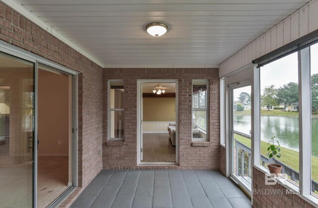 9577 Villas Dr, Foley, AL 36535 - unfurnished sunroom featuring a water view and ceiling fan