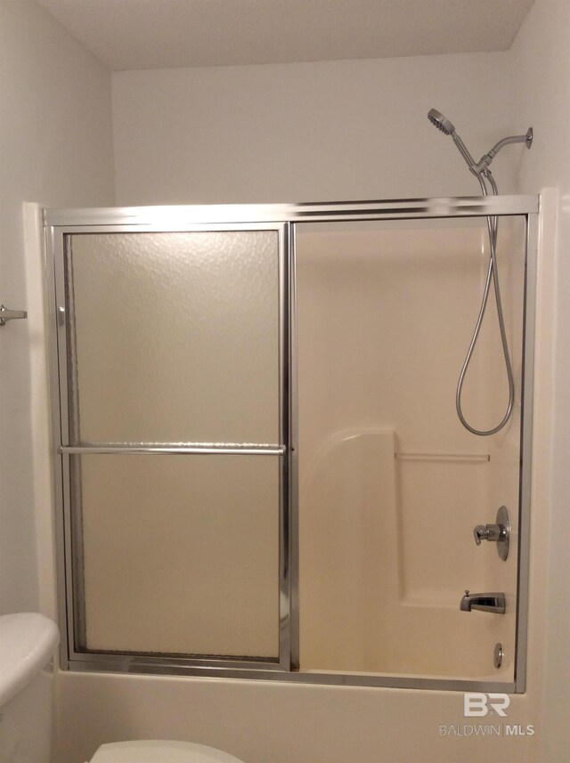 9577 Villas Dr, Foley, AL 36535 - bathroom featuring enclosed tub / shower combo and toilet