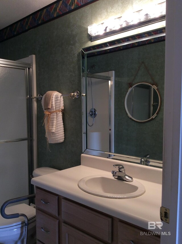 9577 Villas Dr, Foley, AL 36535 - full bathroom featuring vanity and a shower with shower door