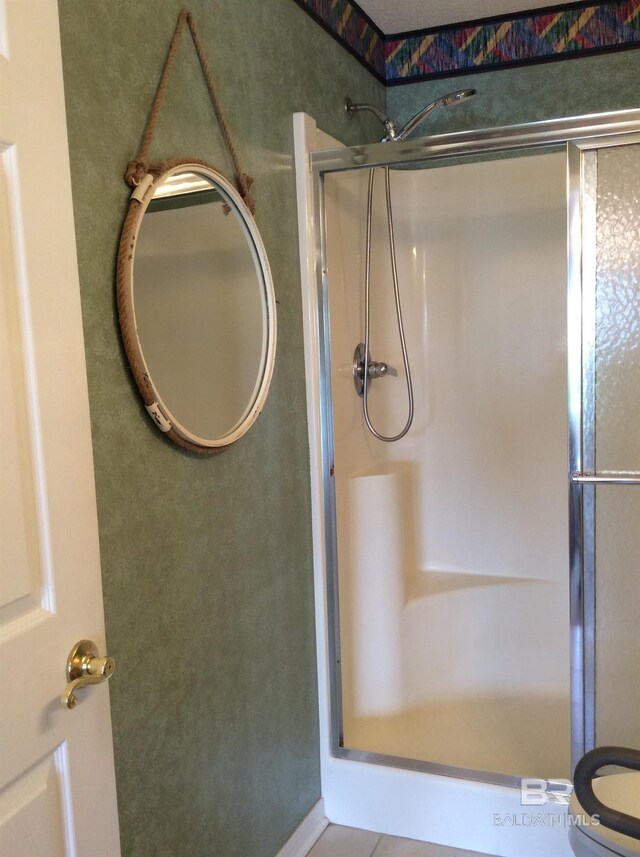 9577 Villas Dr, Foley, AL 36535 - bathroom with a stall shower and tile patterned flooring