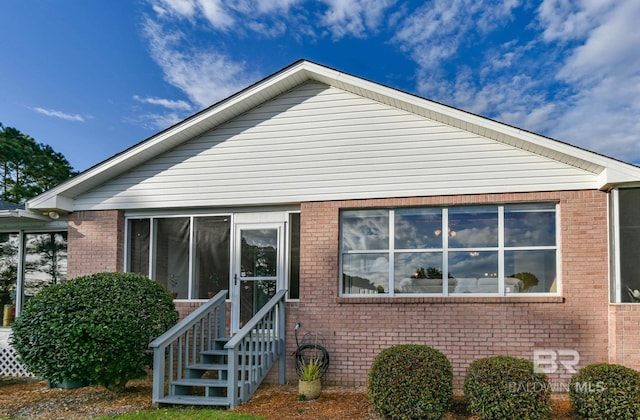 9577 Villas Dr, Foley, AL 36535 - back of house featuring brick siding and entry steps