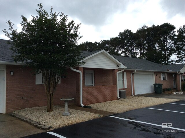 9577 Villas Dr, Foley, AL 36535 - ranch-style home with uncovered parking, brick siding, and roof with shingles