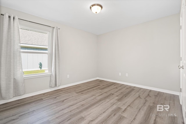 empty room with light wood-type flooring