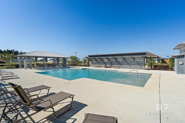 view of pool featuring a patio and a gazebo