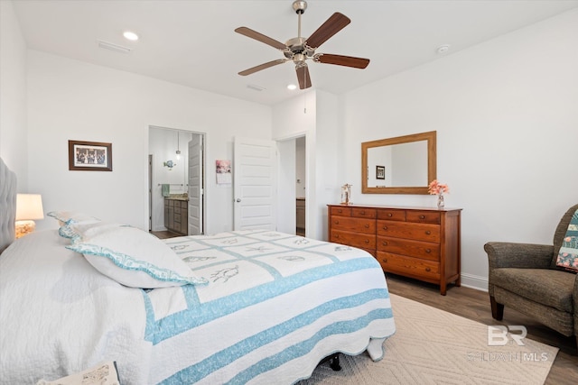 4299 Montague Dr, Gulf Shores, AL 36542 - bedroom with wood finished floors, a ceiling fan, recessed lighting, and connected bathroom