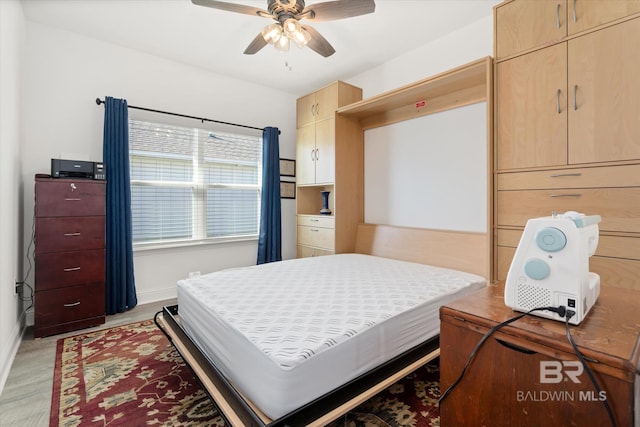 4299 Montague Dr, Gulf Shores, AL 36542 - bedroom with light wood finished floors, baseboards, and a ceiling fan