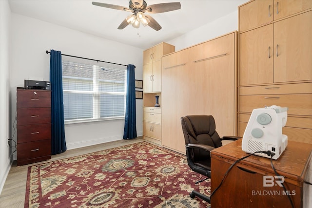 4299 Montague Dr, Gulf Shores, AL 36542 - office area featuring a ceiling fan, baseboards, and light wood-style flooring