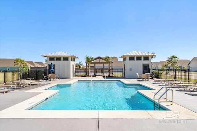 4299 Montague Dr, Gulf Shores, AL 36542 - community pool with a patio and fence