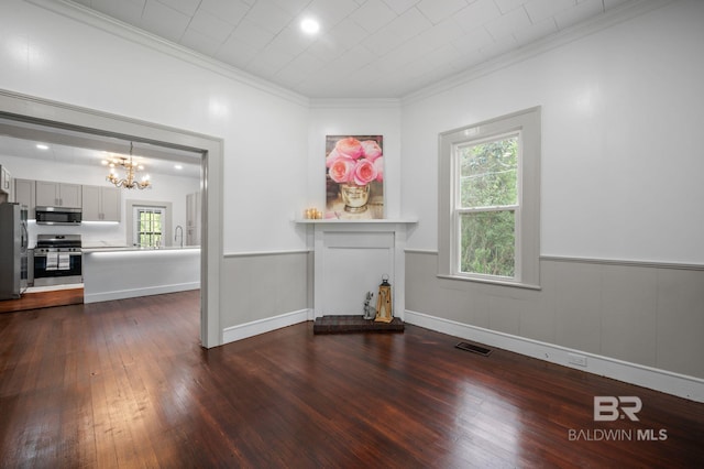 unfurnished living room featuring visible vents, dark wood-type flooring, a chandelier, and a healthy amount of sunlight