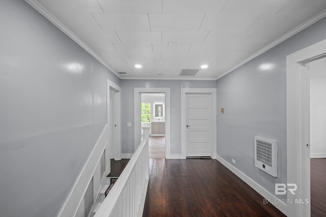 hall featuring crown molding, baseboards, an upstairs landing, and dark wood-style floors