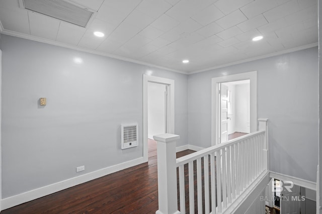 corridor with visible vents, crown molding, baseboards, dark wood-style floors, and an upstairs landing