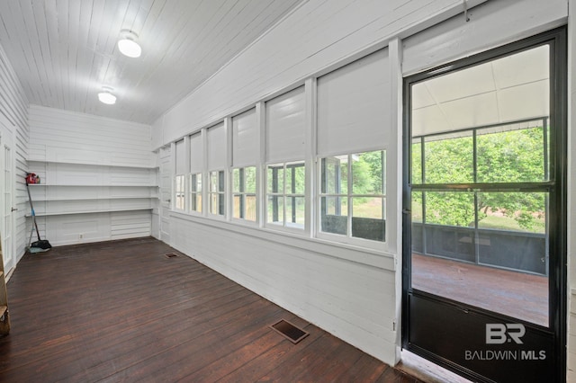 unfurnished sunroom with visible vents