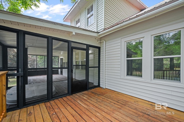 wooden terrace featuring a sunroom