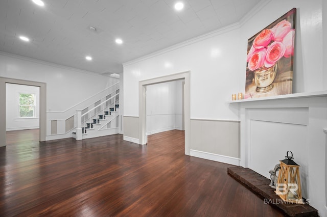 unfurnished living room with crown molding, stairs, wainscoting, wood finished floors, and recessed lighting