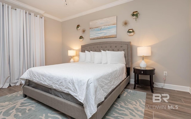 bedroom featuring ornamental molding and wood-type flooring