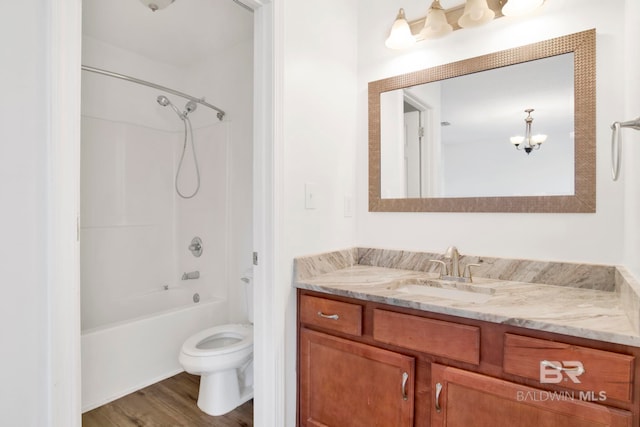 full bathroom featuring hardwood / wood-style flooring, vanity, shower / bathing tub combination, and toilet