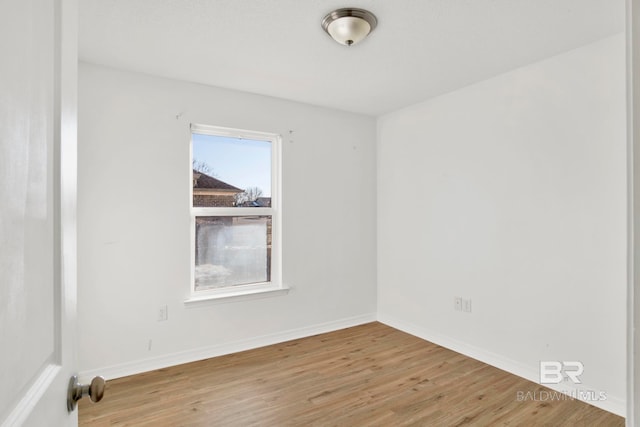 empty room with hardwood / wood-style floors