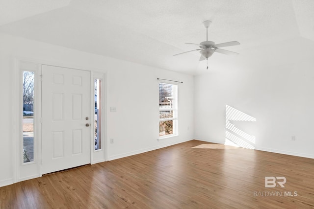 entrance foyer featuring ceiling fan and wood-type flooring