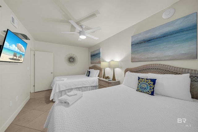 bedroom featuring tile patterned flooring, baseboards, a ceiling fan, and visible vents