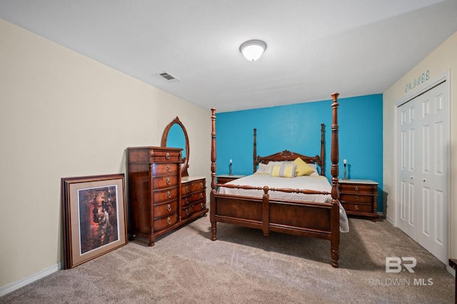 bedroom with light carpet and a closet