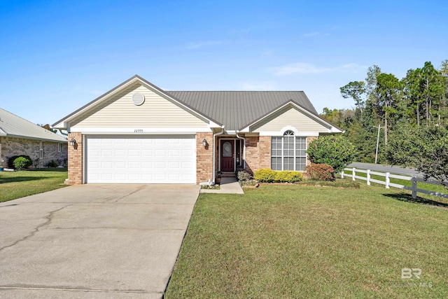 ranch-style house featuring a front yard and a garage