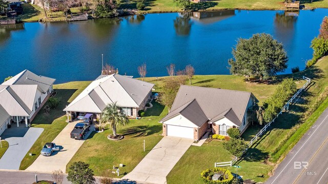 drone / aerial view with a water view