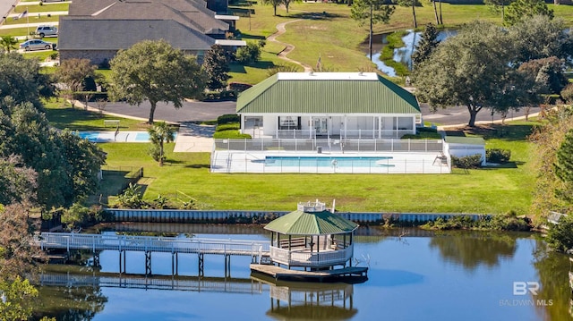 birds eye view of property with a water view